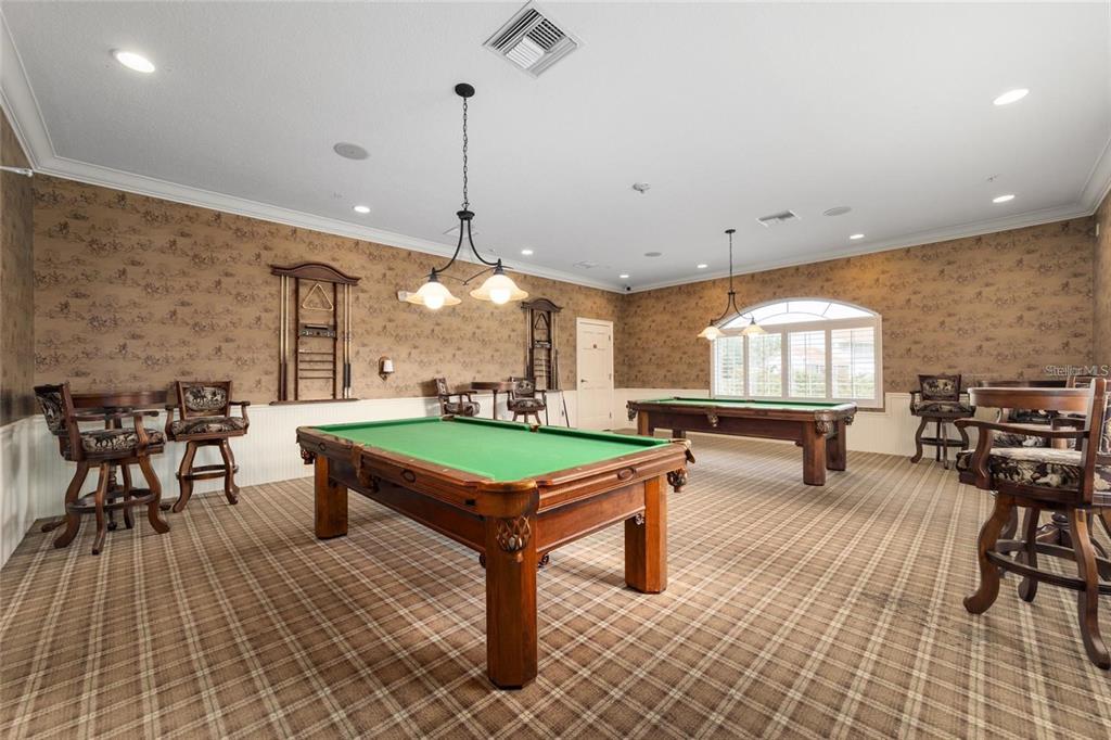 5427 Compass Point, Unit 1 Oxford, FL 34484 - Photo 50 of 51 a room with lots of furniture and a chandelier