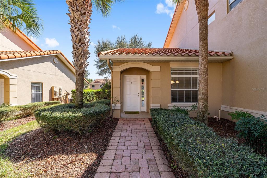 5427 Compass Point, Unit 1 Oxford, FL 34484 - Photo 6 of 51 a front view of a house with a garden