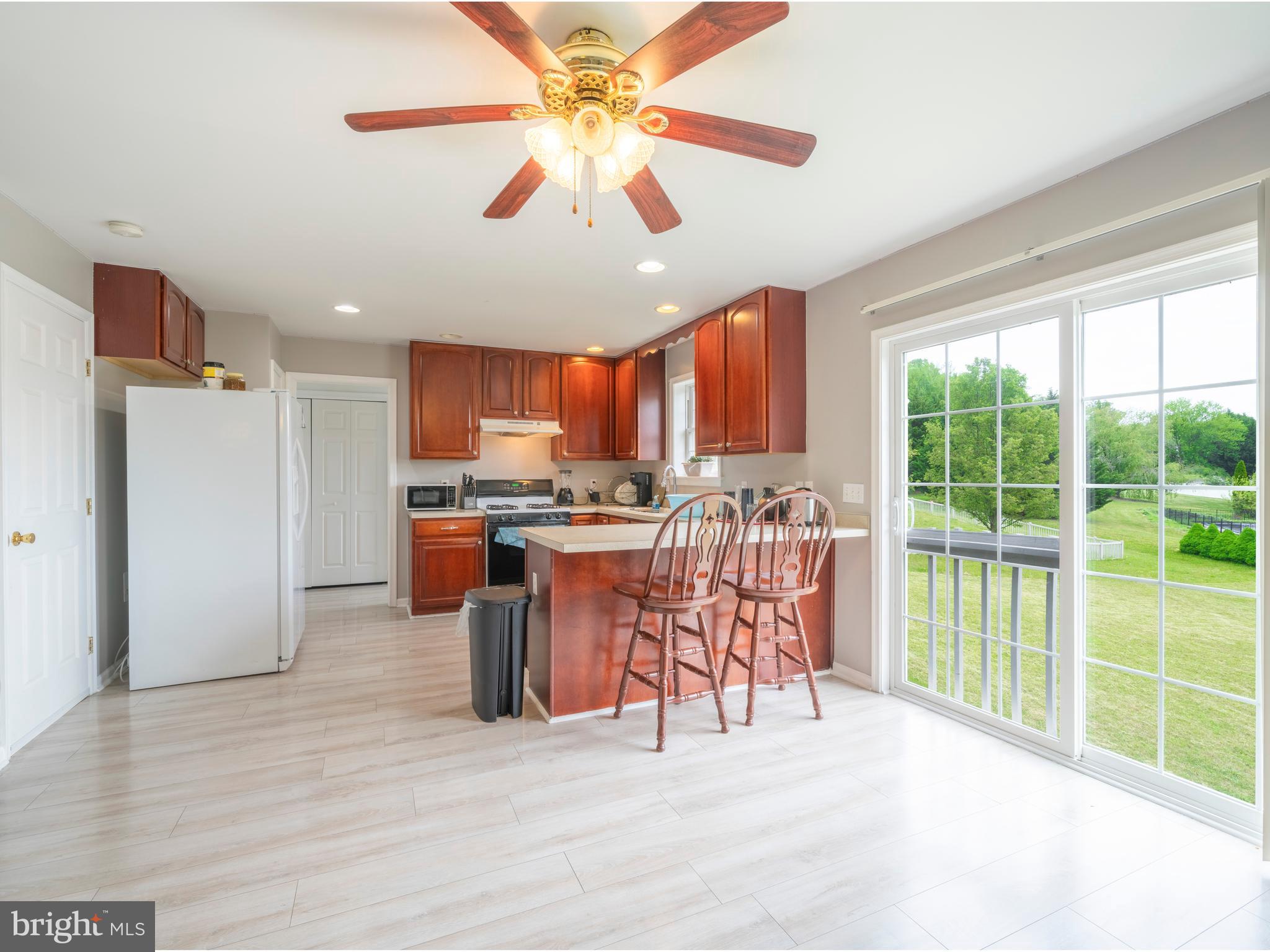 745 Apple Tree Lane Mount Wolf, PA 17347 - Photo 11 of 39 a view of a kitchen with furniture and a kitchen view