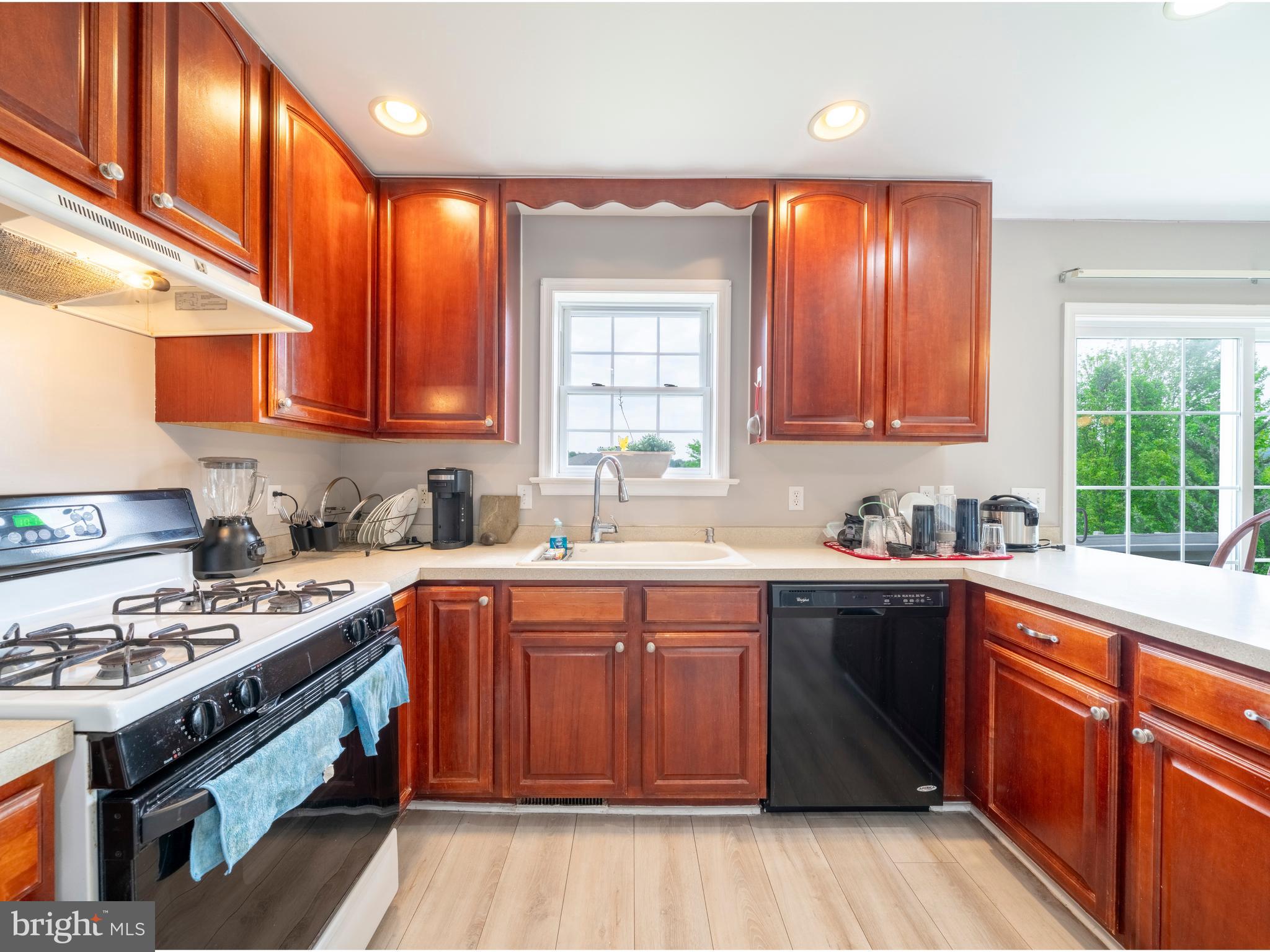 745 Apple Tree Lane Mount Wolf, PA 17347 - Photo 13 of 39 a kitchen with stainless steel appliances granite countertop wooden cabinets a sink and a stove