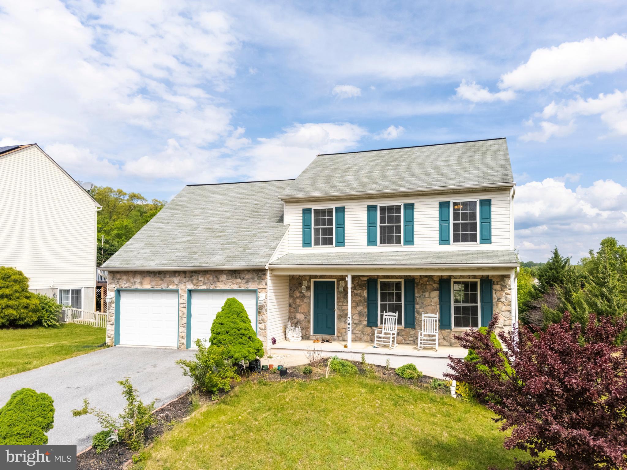 745 Apple Tree Lane Mount Wolf, PA 17347 - Photo 3 of 39 front view of a house with a yard