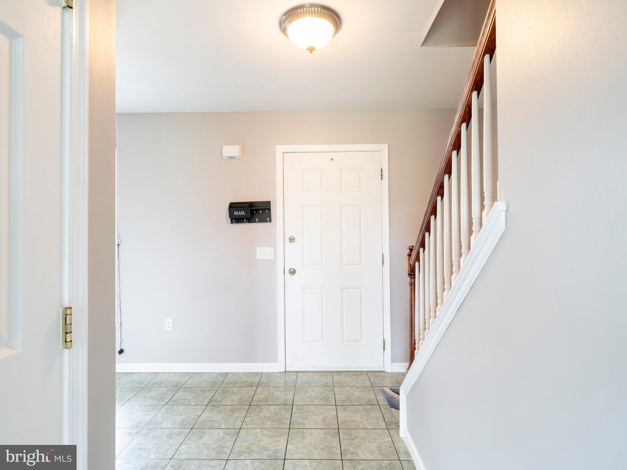 745 Apple Tree Lane Mount Wolf, PA 17347 - Photo 4 of 39 a view of a hallway with staircase