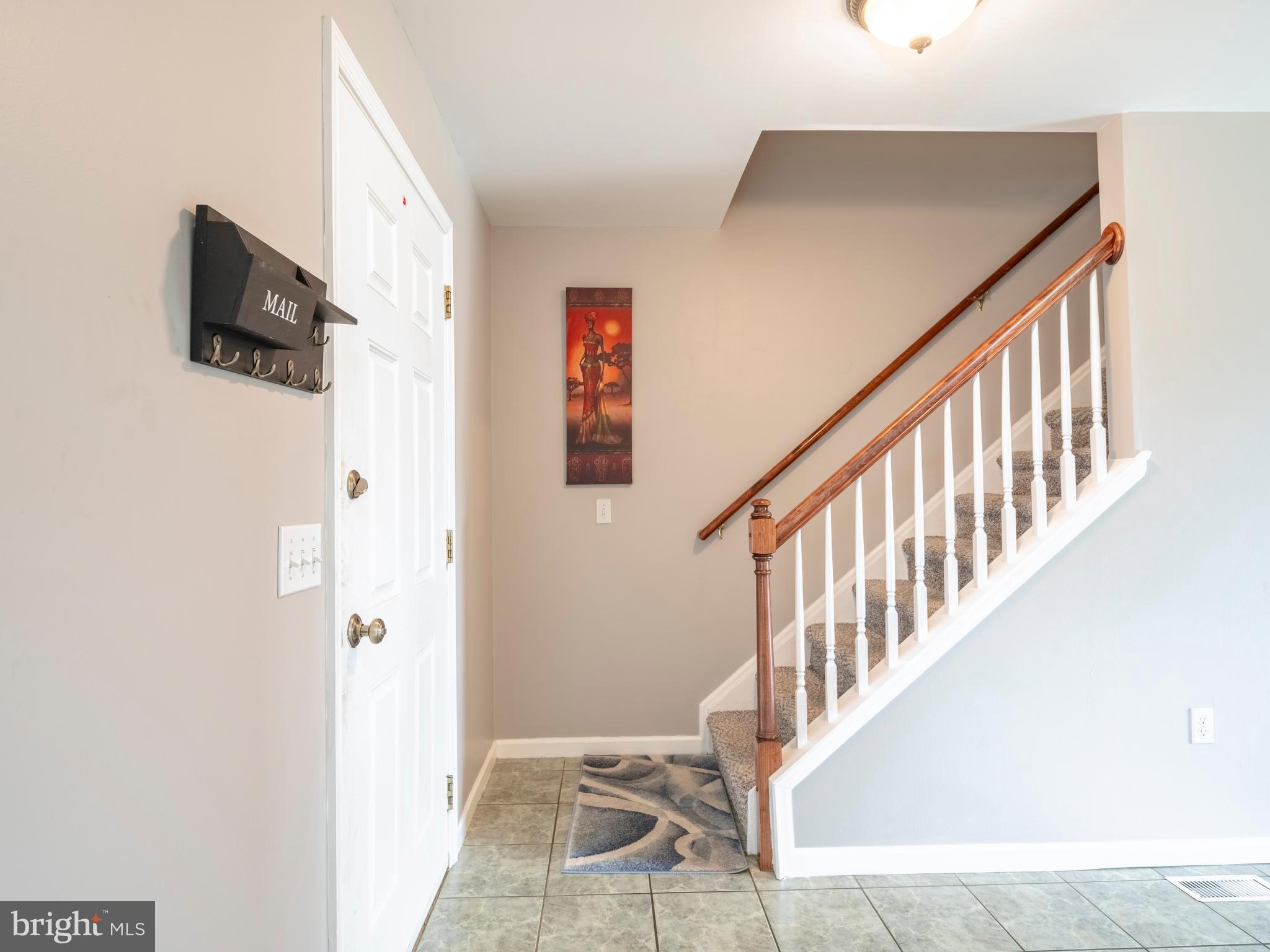 745 Apple Tree Lane Mount Wolf, PA 17347 - Photo 5 of 39 a view of entryway and hall with wooden floor