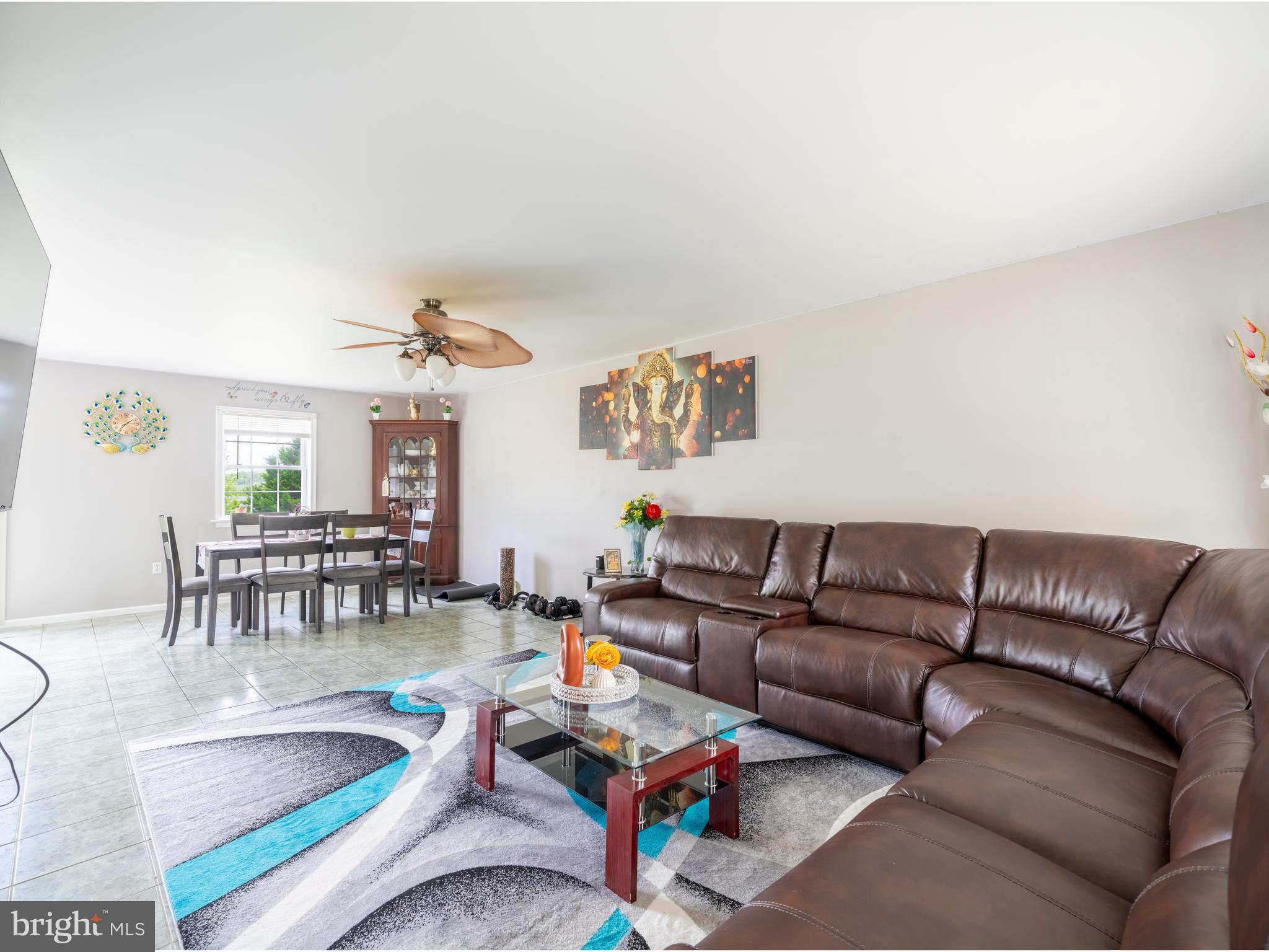 745 Apple Tree Lane Mount Wolf, PA 17347 - Photo 7 of 39 a living room with furniture and a table