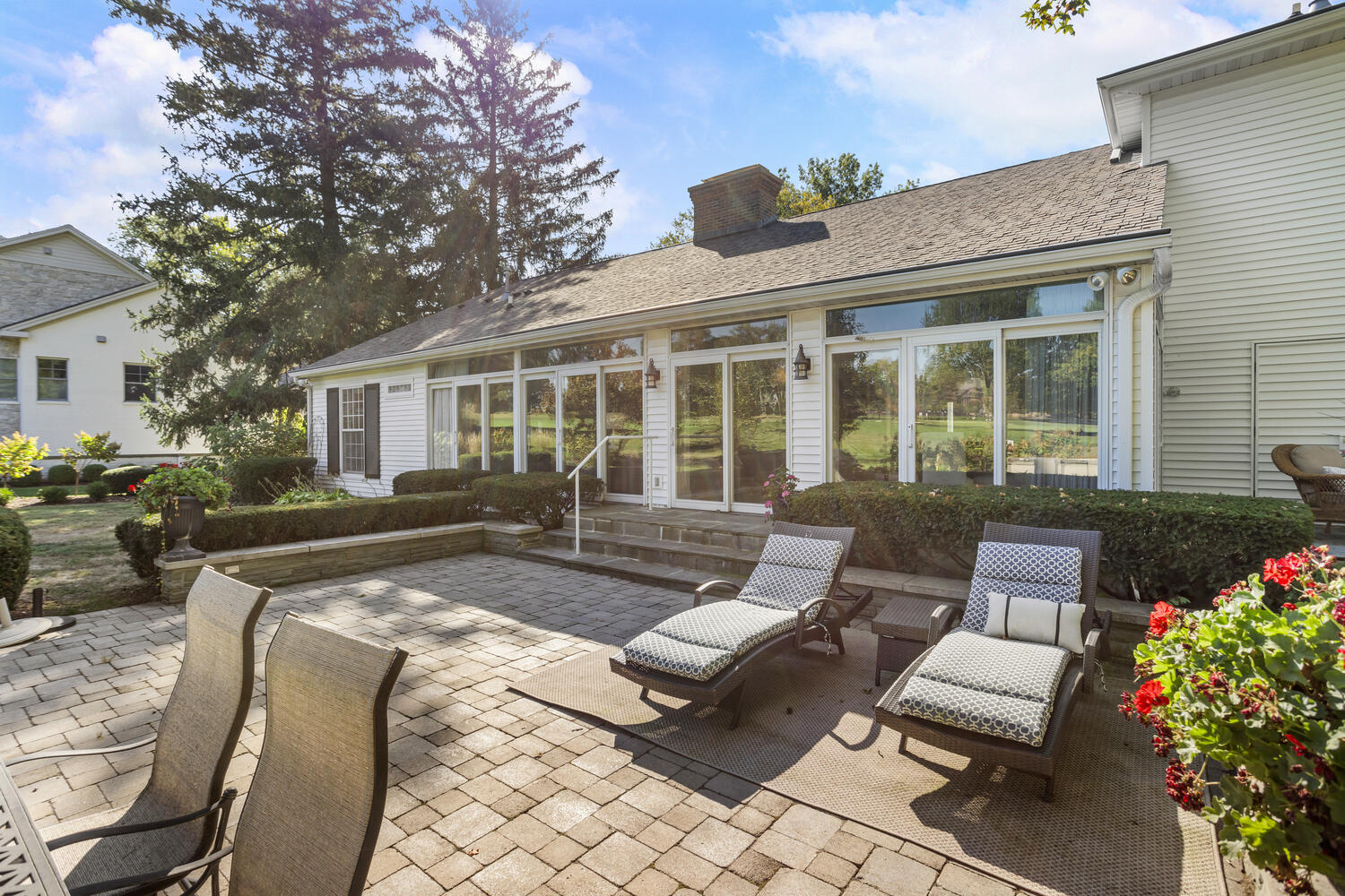 7 Greencroft Drive Champaign, IL 61821 - Photo 35 of 44 a view of a patio with couches table and chairs and potted plants