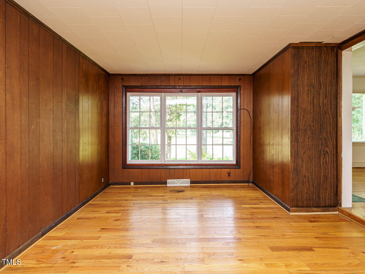 1191 Old Sanford Road Moncure, NC 27559 - Photo 10 of 30 a view of an empty room with window and wooden floor