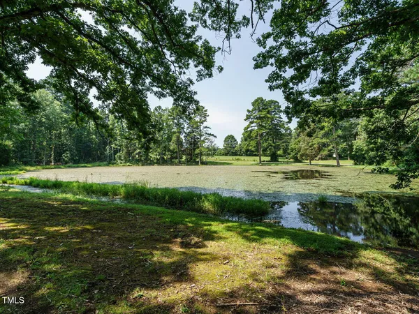 a view of a lake with a yard