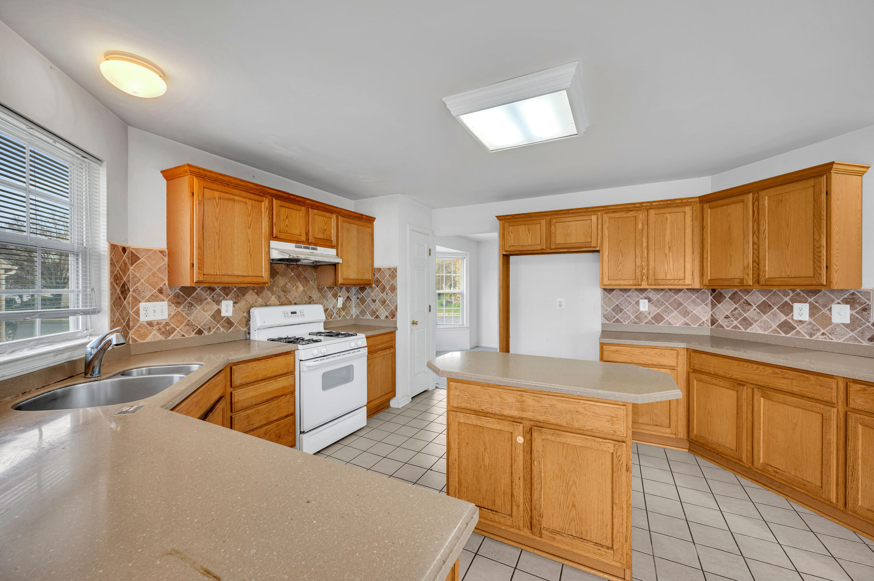 1179 Blair Road Bethlehem, PA 18017 - Photo 13 of 41 a large kitchen with kitchen island granite countertop lots of counter top space and stainless steel appliances