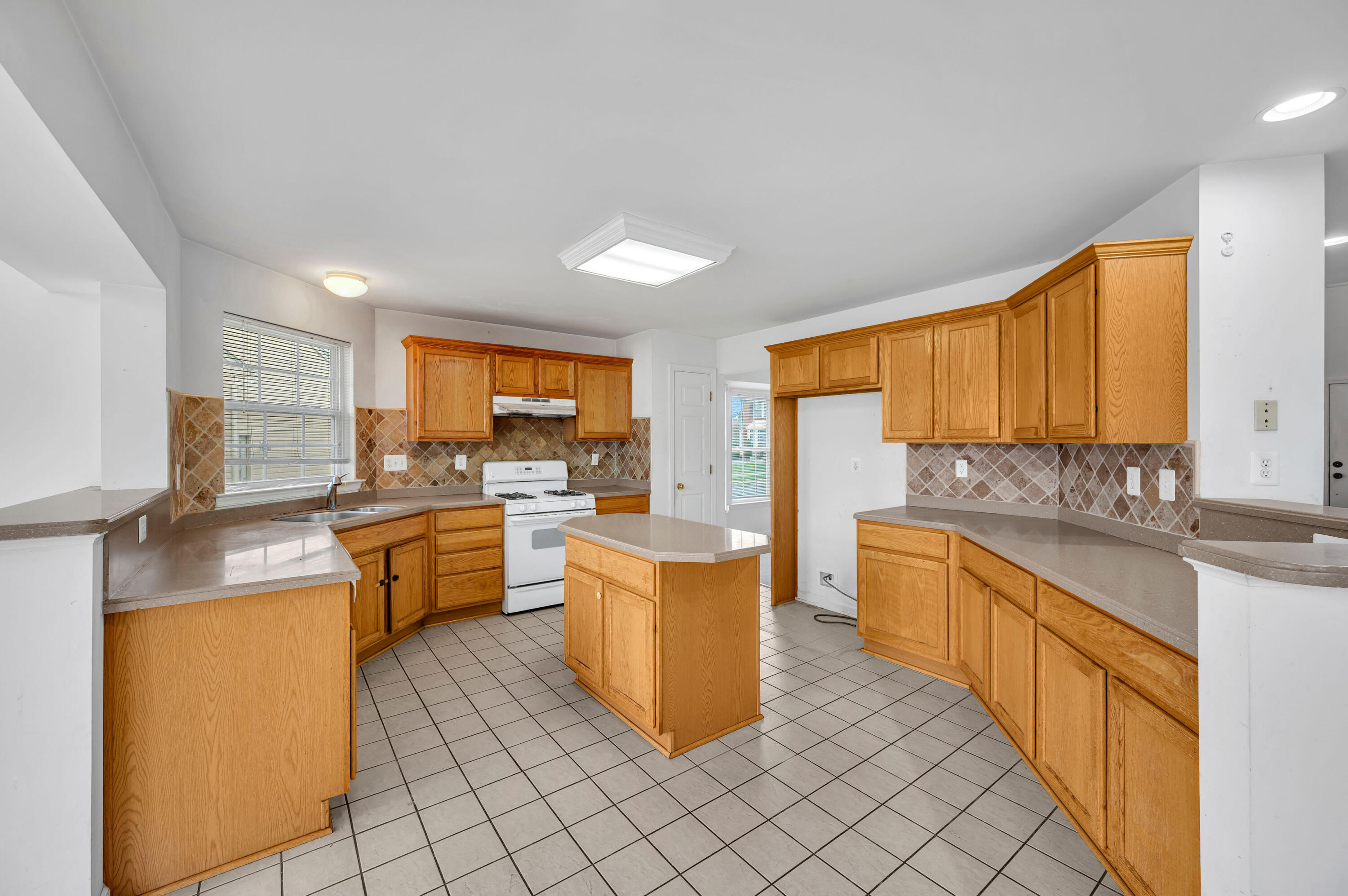 1179 Blair Road Bethlehem, PA 18017 - Photo 14 of 41 a kitchen with stainless steel appliances a sink counter space and a window