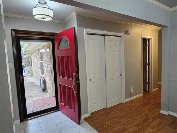a view of a hallway to rooms