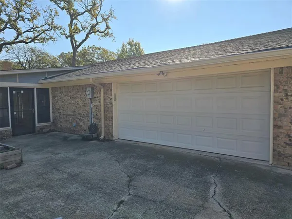 a view of a house with a tree