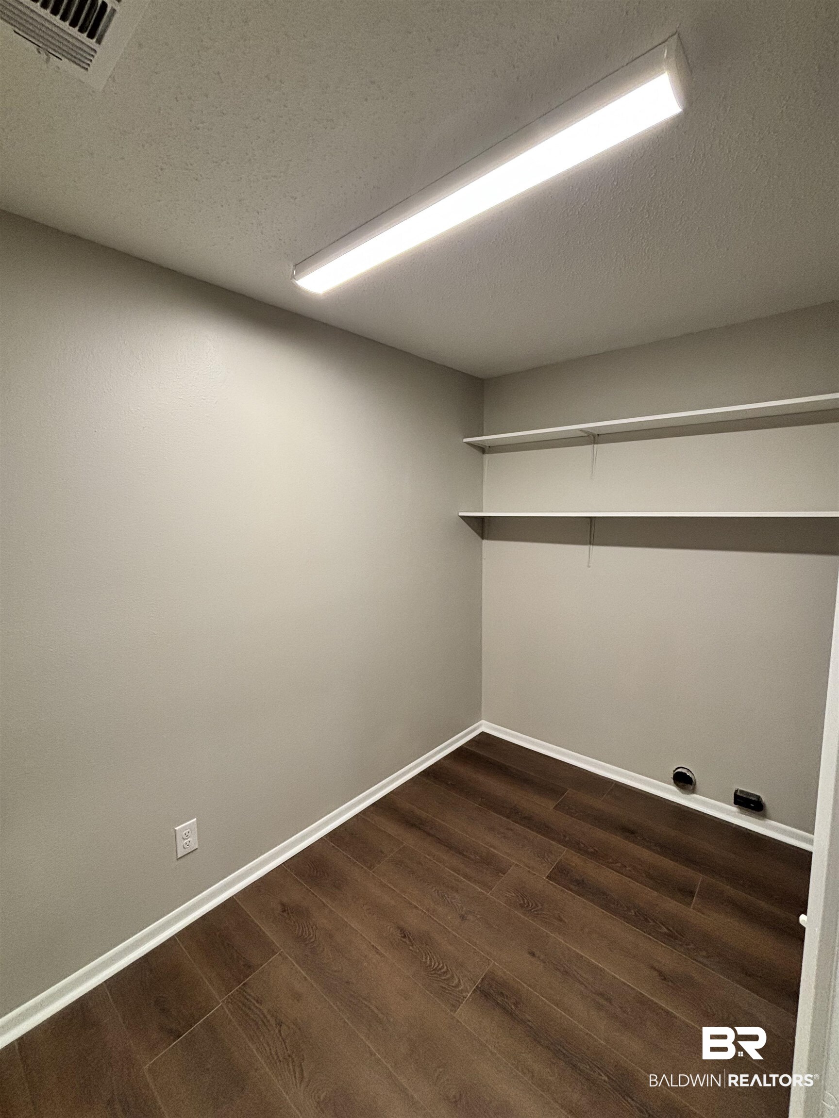10 Soldiers Route Daphne, AL 36527 - Photo 15 of 26 Washroom with a textured ceiling and dark wood-style floors