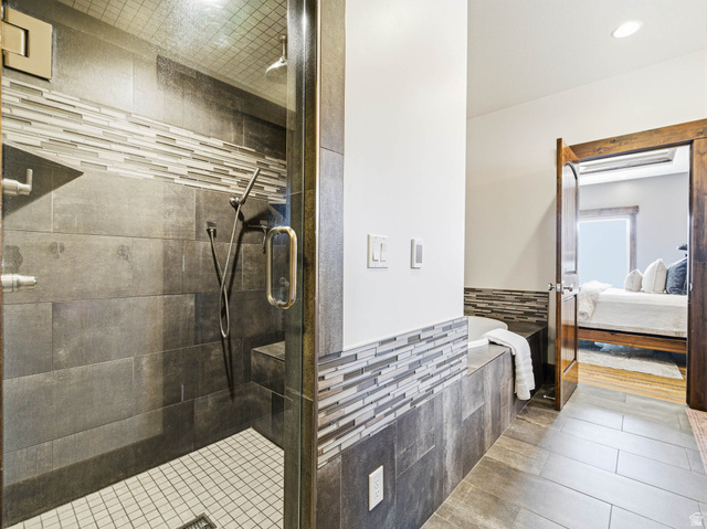 402 Shadow Hill Road Wanship, UT 84017 - Photo 28 of 90 Full bathroom featuring a shower stall, connected bathroom, tile patterned flooring, and recessed lighting