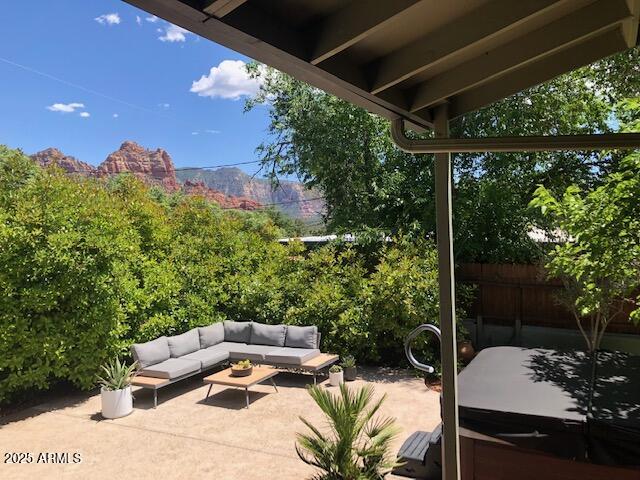 325 Smith Road Sedona, AZ 86336 - Photo 2 of 11 a outdoor living space with furniture and garden view