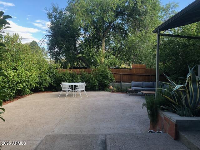 325 Smith Road Sedona, AZ 86336 - Photo 10 of 11 a view of backyard with seating space and trees
