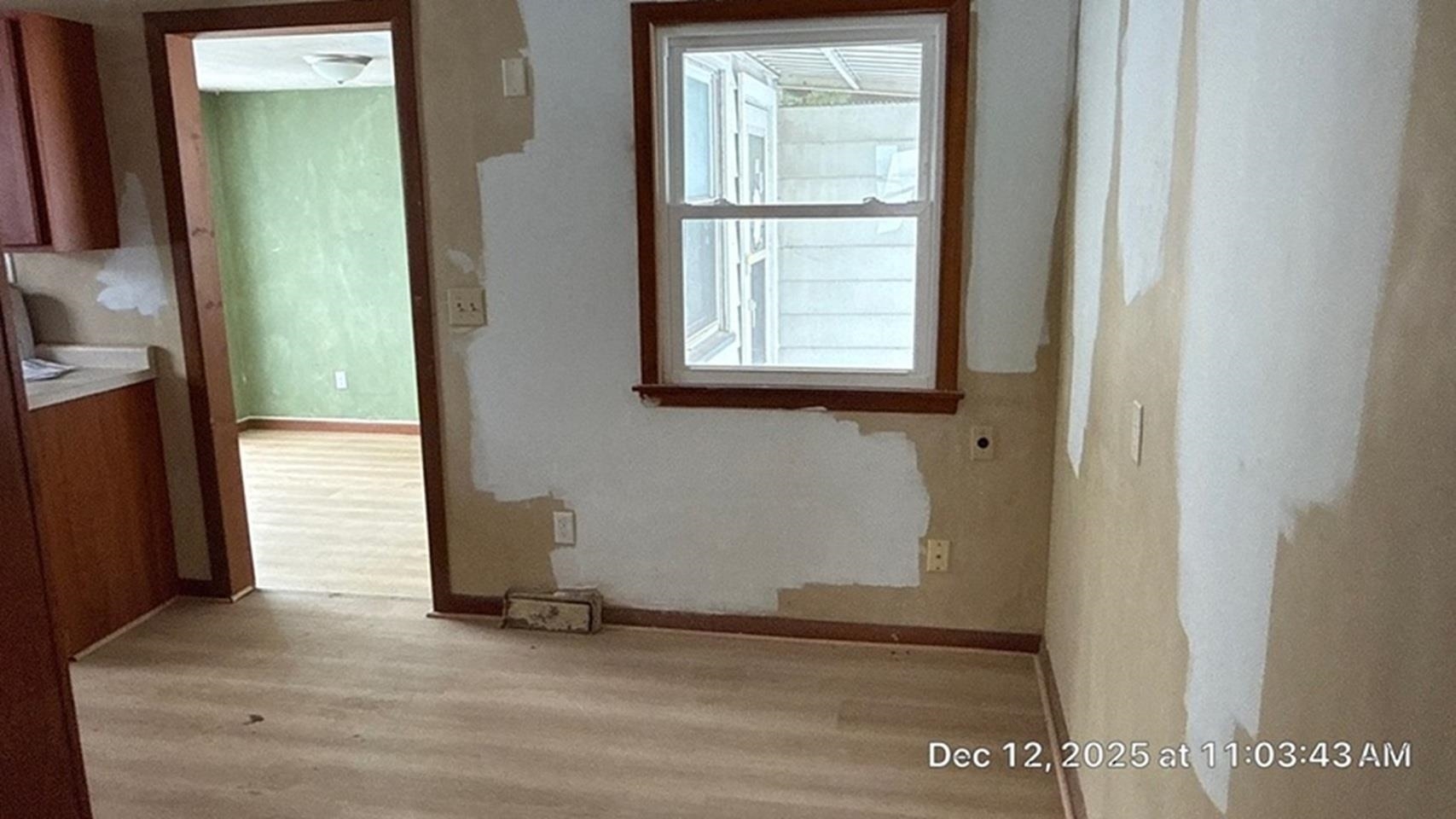 11315 16th Street Milan, IL 61264 - Photo 4 of 9 a view of an empty room with a window