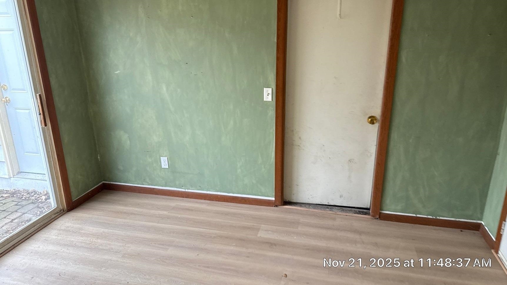 11315 16th Street Milan, IL 61264 - Photo 8 of 9 a view of an empty room with wooden floor