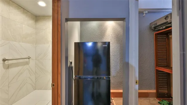 a view of a living room with a fireplace and painted walls