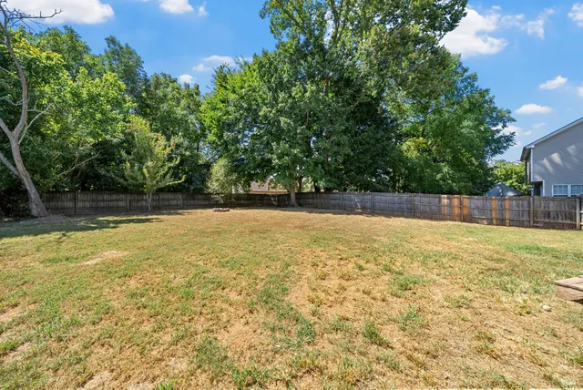 a view of a swimming pool with an outdoor space and seating area