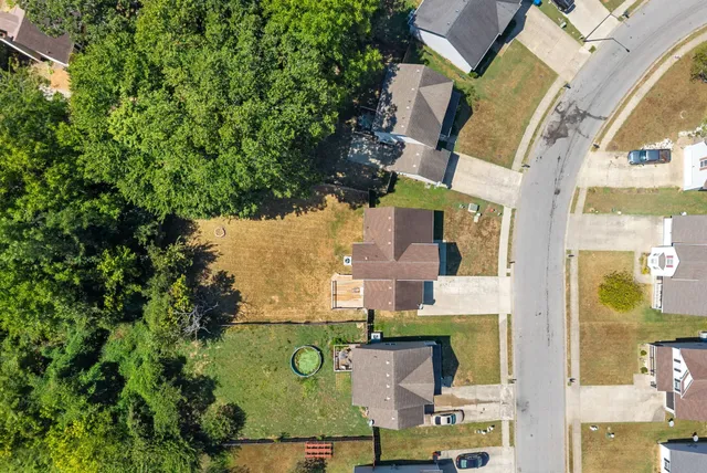 an aerial view of houses with yard