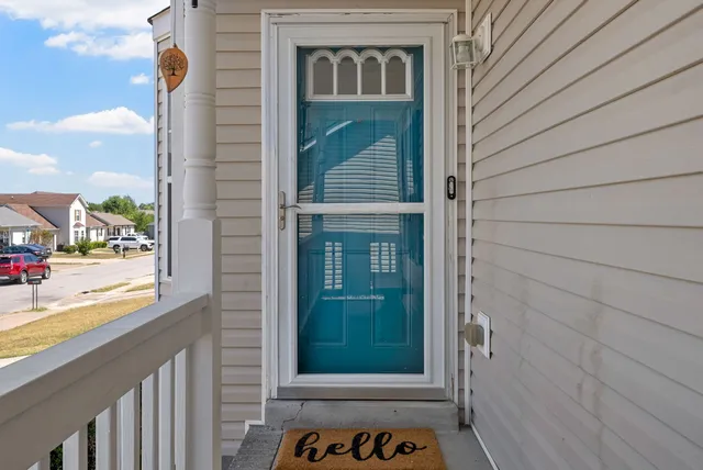 a view of a door and a window