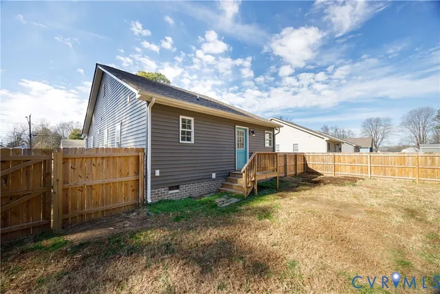 a view of a yard with large trees