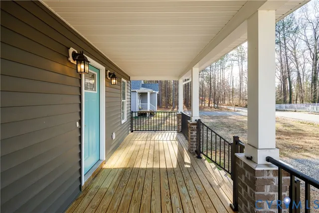 a view of balcony with wooden floor