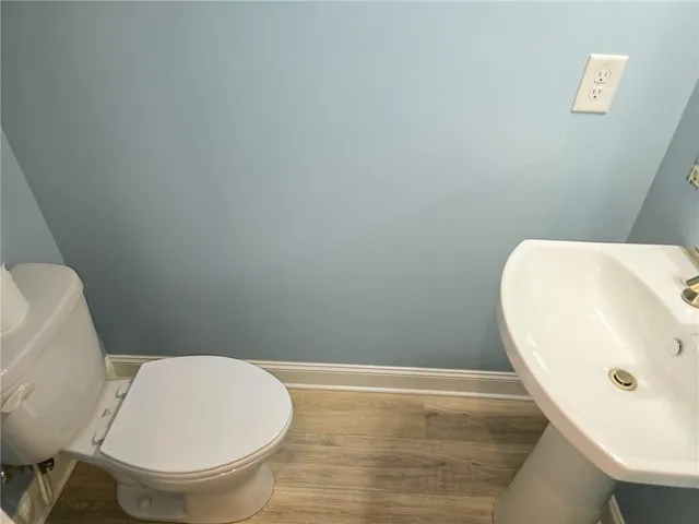 a bathroom with a toilet and a sink