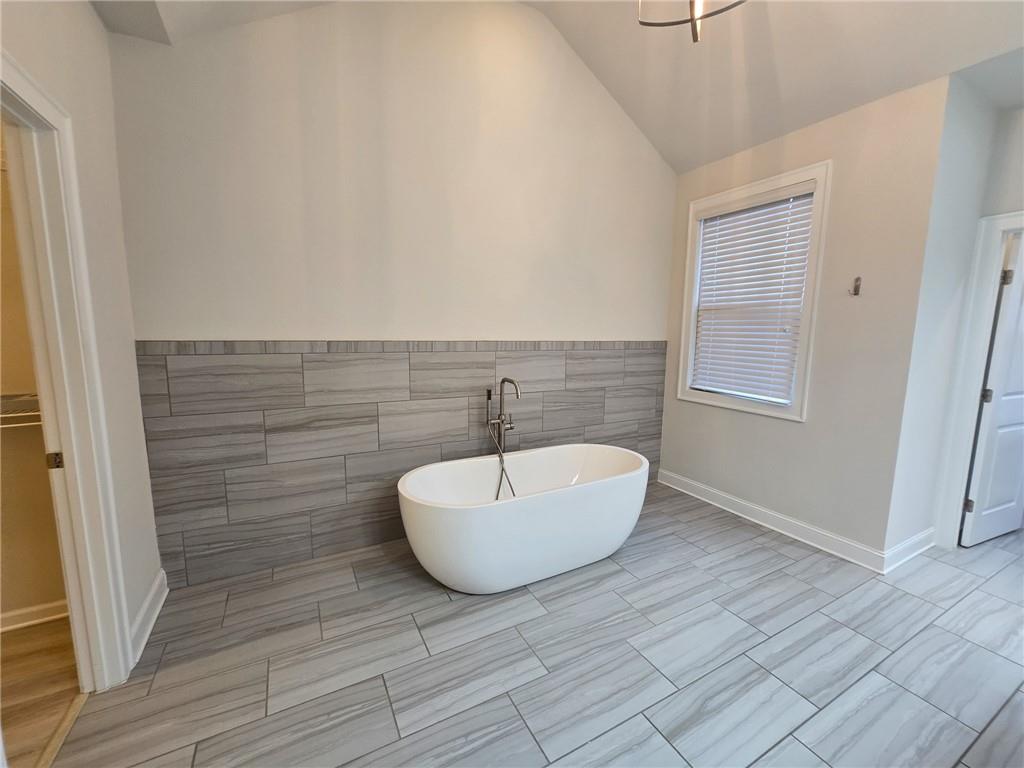 1758 Glenview Park Circle Duluth, GA 30097 - Photo 14 of 45 a bathroom with a sink and a mirror