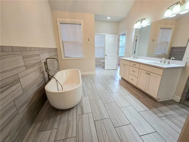 a bathroom with a sink and mirror