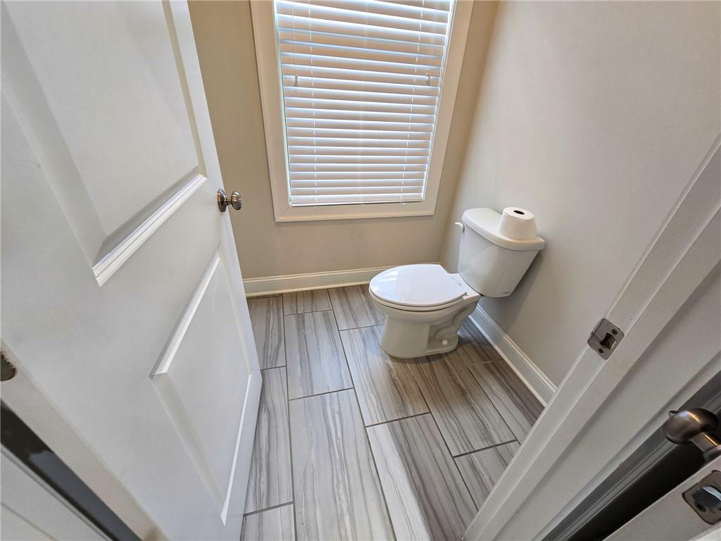 1758 Glenview Park Circle Duluth, GA 30097 - Photo 18 of 45 a bathroom with a toilet and a hardwood