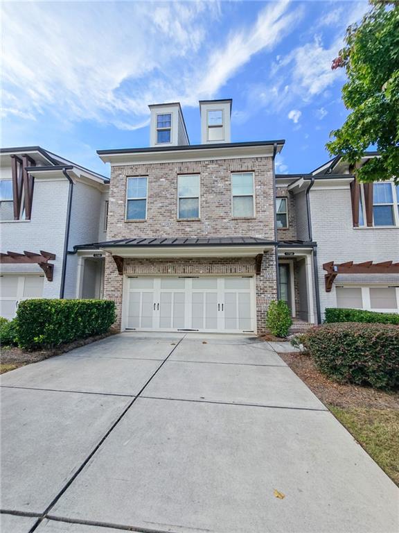 1758 Glenview Park Circle Duluth, GA 30097 - Photo 2 of 45 a front view of a house with a yard and garage