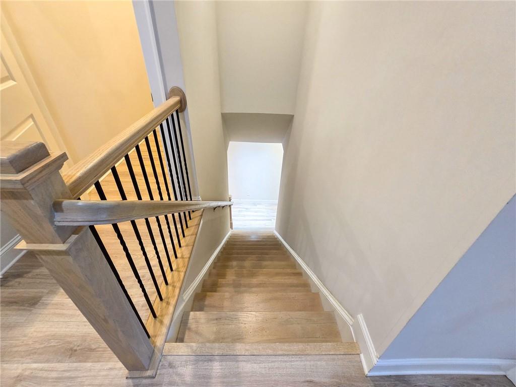 1758 Glenview Park Circle Duluth, GA 30097 - Photo 21 of 45 a view of staircase with wooden floor and door