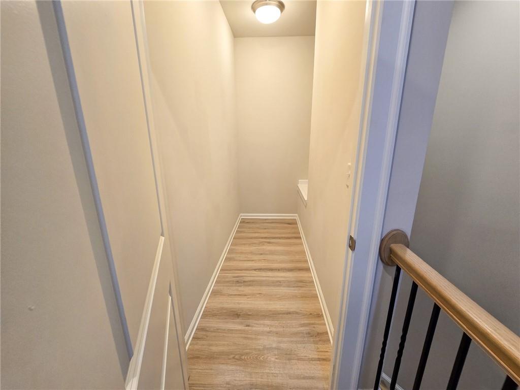 1758 Glenview Park Circle Duluth, GA 30097 - Photo 22 of 45 a view of a hallway with wooden floor