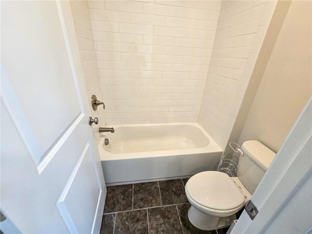 1758 Glenview Park Circle Duluth, GA 30097 - Photo 25 of 45 a bathroom with a toilet and a bathtub