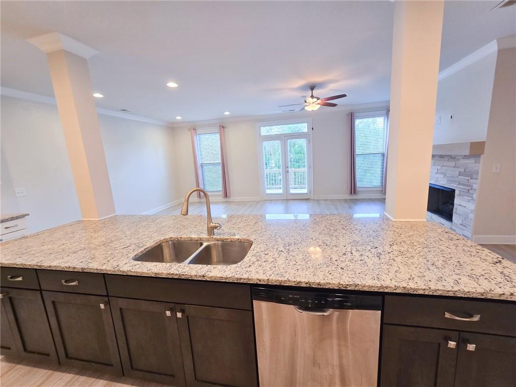 1758 Glenview Park Circle Duluth, GA 30097 - Photo 32 of 45 a kitchen with granite countertop kitchen island a sink and dishwasher