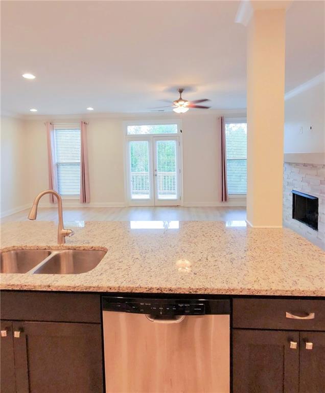 1758 Glenview Park Circle Duluth, GA 30097 - Photo 33 of 45 a kitchen with a sink refrigerator and cabinets