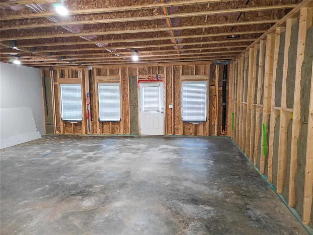 1758 Glenview Park Circle Duluth, GA 30097 - Photo 37 of 45 a view of an empty room with wooden floor and cabinets