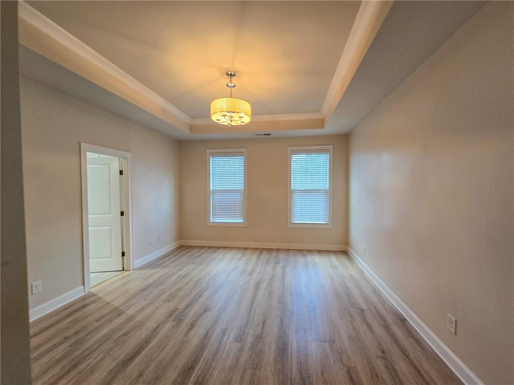 1758 Glenview Park Circle Duluth, GA 30097 - Photo 7 of 45 a view of empty room with wooden floor and window