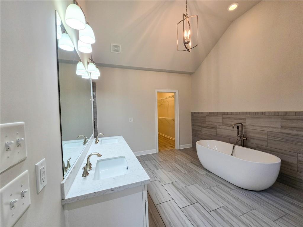 1758 Glenview Park Circle Duluth, GA 30097 - Photo 9 of 45 a bathroom with a sink and a mirror