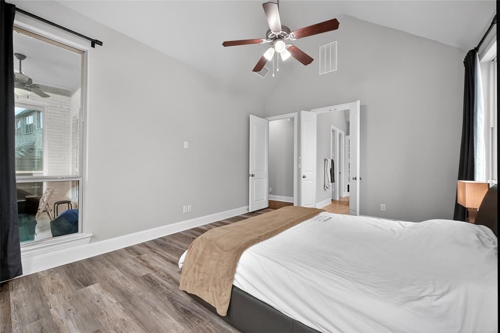 1039 Stephen Street Allen, TX 75013 - Photo 23 of 40 Bedroom with light wood finished floors, a ceiling fan, and a high ceiling