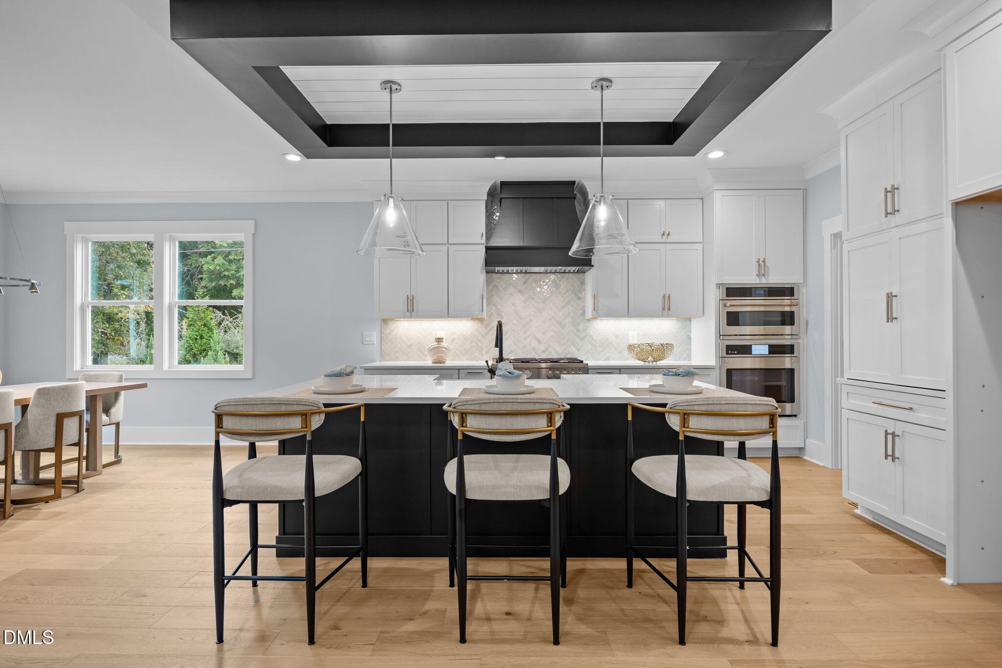 10 Carnation Road Youngsville, NC 27596 - Photo 2 of 44 a kitchen with stainless steel appliances kitchen island granite countertop a table chairs sink and cabinets