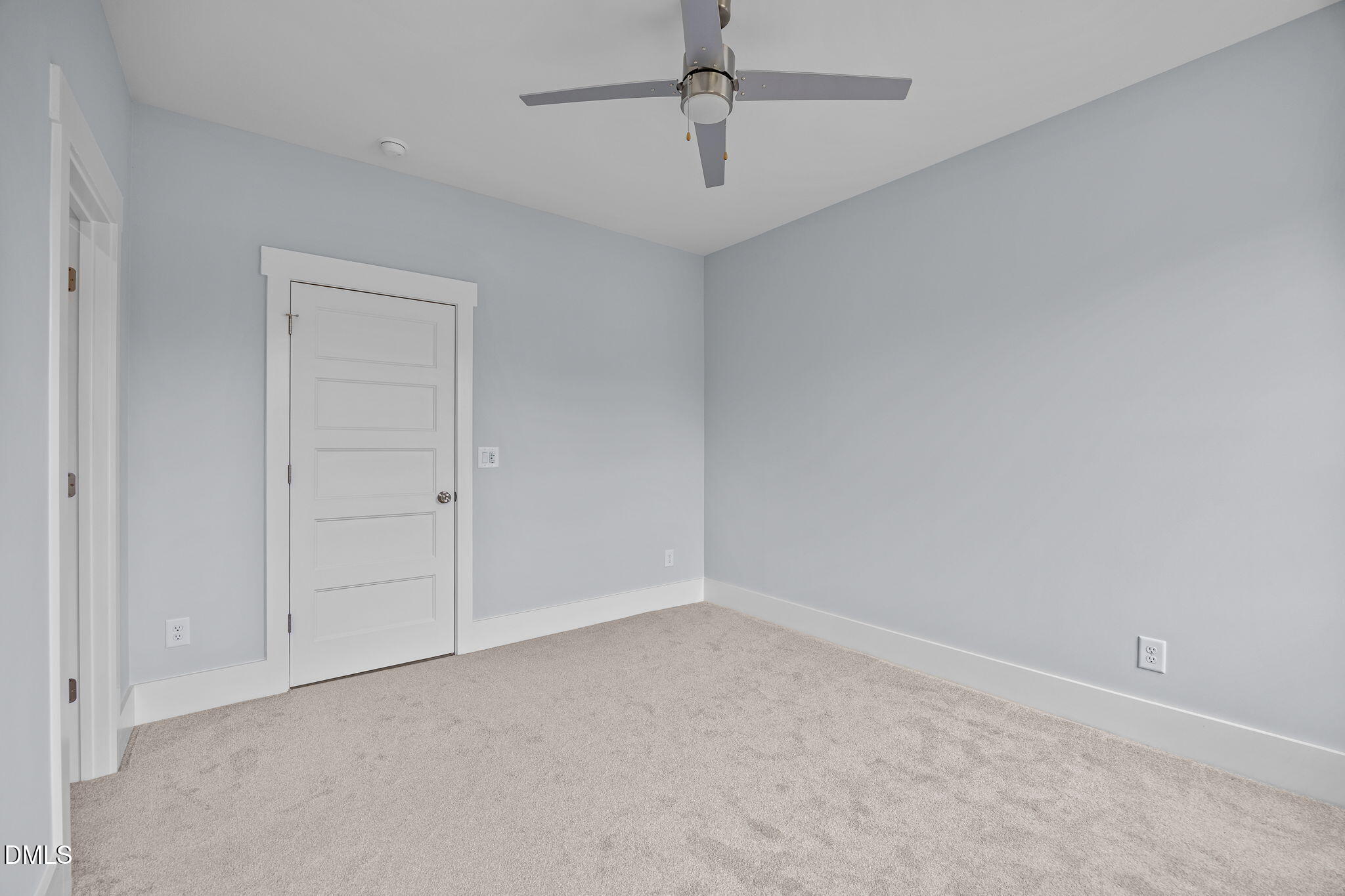 10 Carnation Road Youngsville, NC 27596 - Photo 28 of 44 an empty room with a ceiling fan and carpet