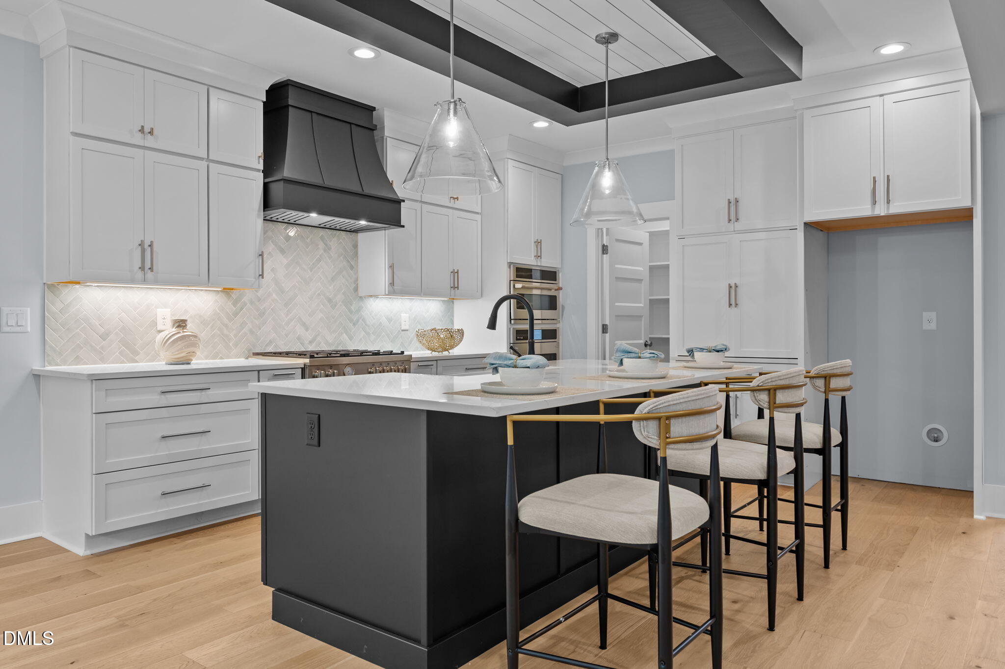 10 Carnation Road Youngsville, NC 27596 - Photo 3 of 44 a kitchen with a sink cabinets and wooden floor