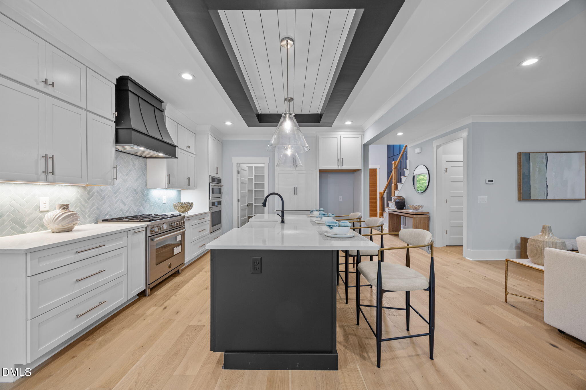 10 Carnation Road Youngsville, NC 27596 - Photo 6 of 44 a kitchen with stainless steel appliances granite countertop a sink a stove a refrigerator cabinets and chairs