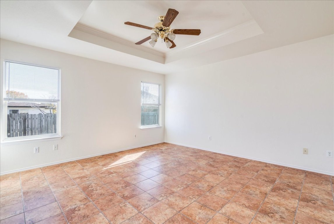 116 Keegans Way Kyle, TX 78640 - Photo 15 of 30 an empty room with a window and a fan