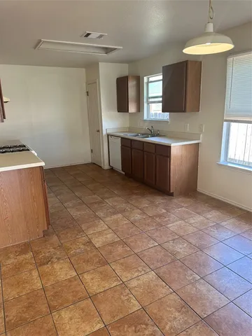 a view of a kitchen with a sink