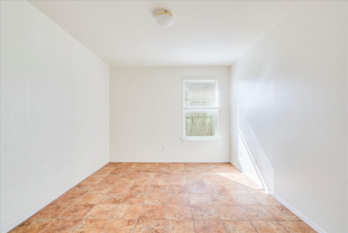 116 Keegans Way Kyle, TX 78640 - Photo 17 of 30 an empty room with a white walls and a window