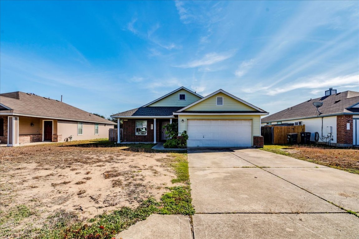 116 Keegans Way Kyle, TX 78640 - Photo 2 of 30 a front view of a house with yard