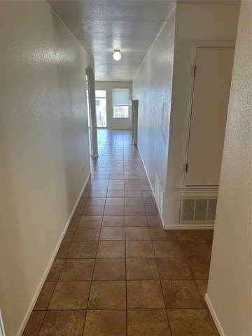 a hallway with wooden floor